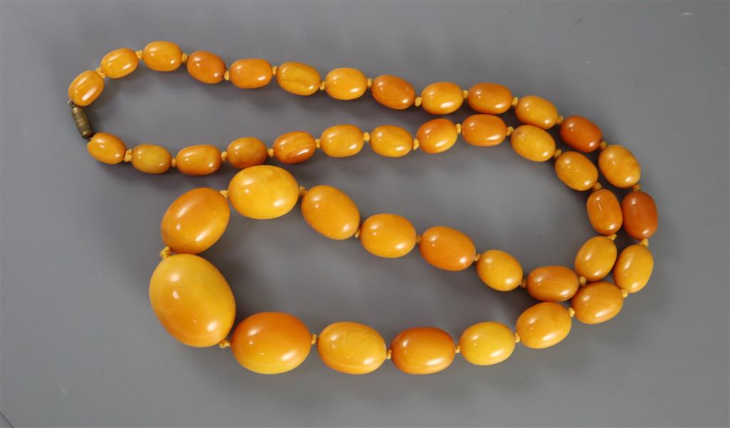 A single strand graduated oval amber bead necklace, 86cm, gross weight 112 grams,